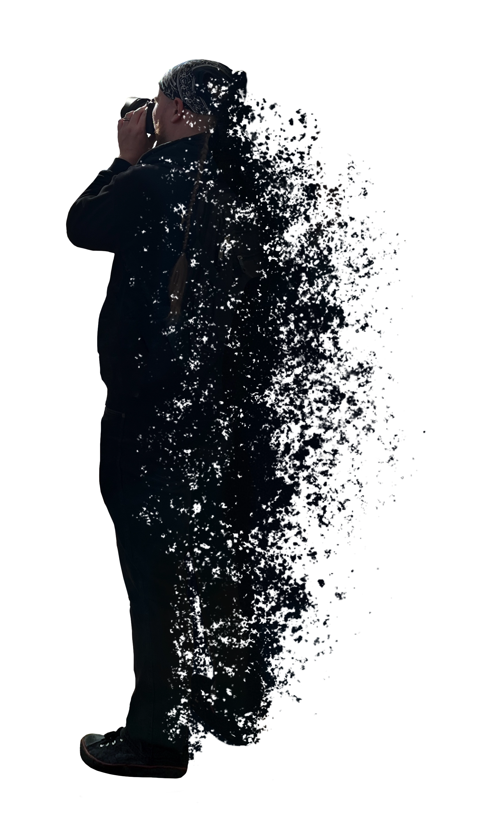 Zouberi taking a photo and dissolving to the right
